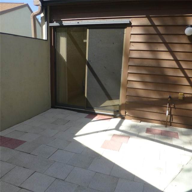 doorway to property featuring a patio area