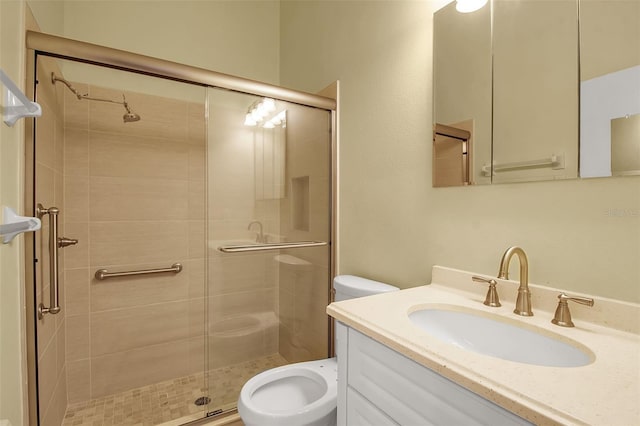 bathroom with vanity, toilet, and walk in shower