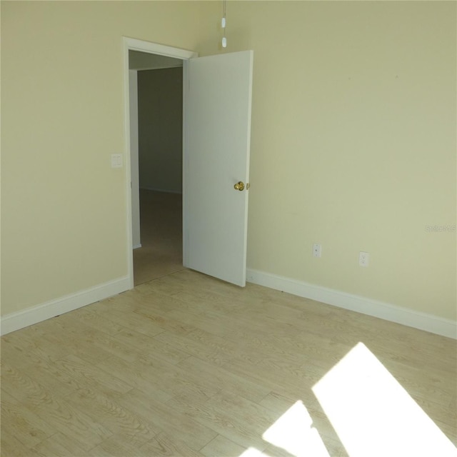 empty room with light wood-type flooring