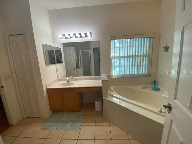 bathroom with vanity, separate shower and tub, and tile patterned flooring