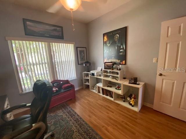 office featuring hardwood / wood-style floors and ceiling fan