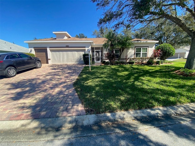 view of front facade with a front lawn and a garage