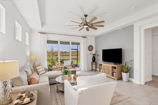 living room with ceiling fan and light wood-type flooring