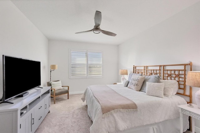 bedroom with light carpet and ceiling fan