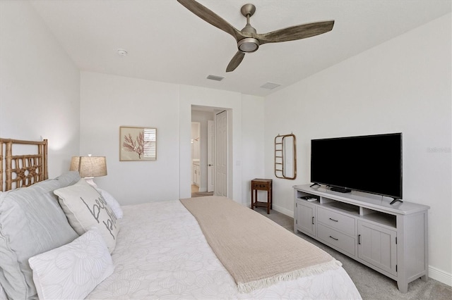 carpeted bedroom featuring ensuite bathroom and ceiling fan