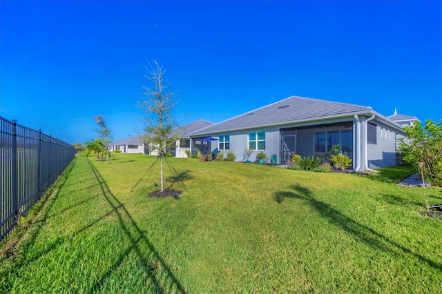 view of yard with a sunroom