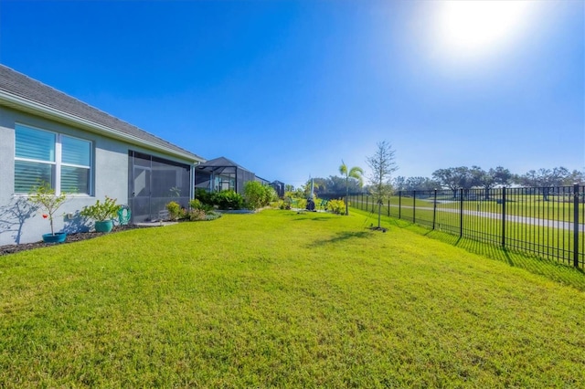 view of yard with a sunroom