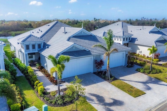 view of front of home featuring a front yard and a garage