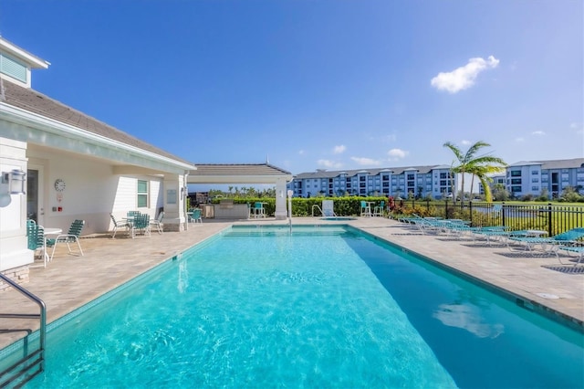 view of pool featuring a patio