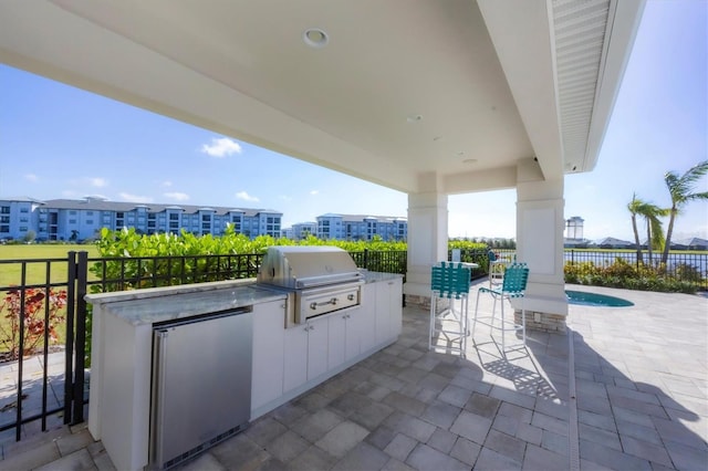 view of patio / terrace with grilling area and exterior kitchen