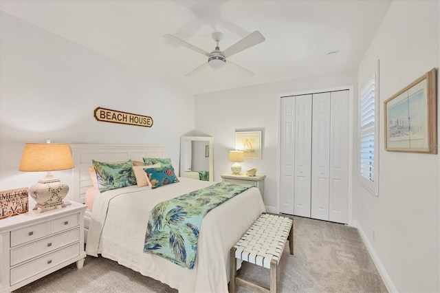 bedroom with a closet, carpet flooring, ceiling fan, and baseboards