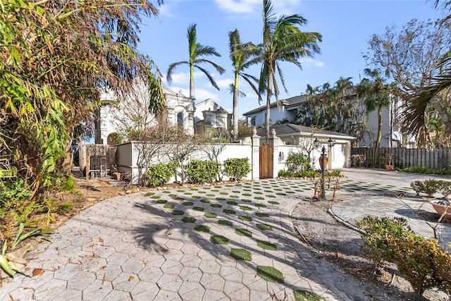 8213 Midnight Pass Rd, Sarasota, FL 34242 - view of front of home featuring fence, driveway, a gate, and a garage