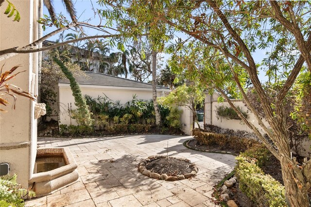8213 Midnight Pass Rd, Sarasota, FL 34242 - view of patio featuring a fire pit