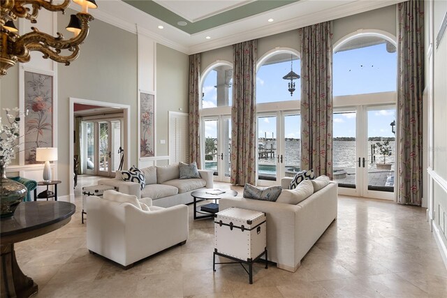 8213 Midnight Pass Rd, Sarasota, FL 34242 - living area with crown molding, a healthy amount of sunlight, french doors, and a towering ceiling