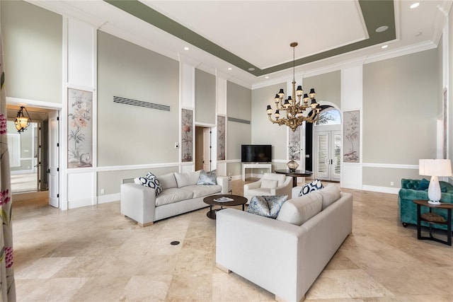 8213 Midnight Pass Rd, Sarasota, FL 34242 - living area with crown molding, a raised ceiling, a notable chandelier, and a towering ceiling