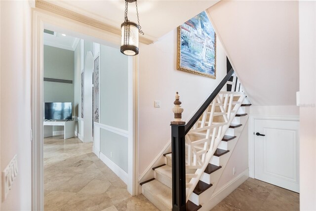 8213 Midnight Pass Rd, Sarasota, FL 34242 - staircase featuring baseboards and ornamental molding