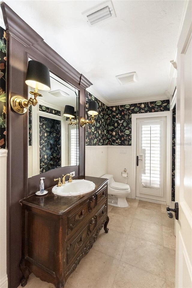 8213 Midnight Pass Rd, Sarasota, FL 34242 - bathroom with vanity, crown molding, wainscoting, toilet, and wallpapered walls