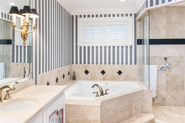 bathroom with vanity, ornamental molding, and independent shower and bath