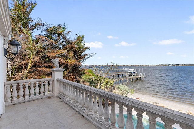 balcony featuring a water view