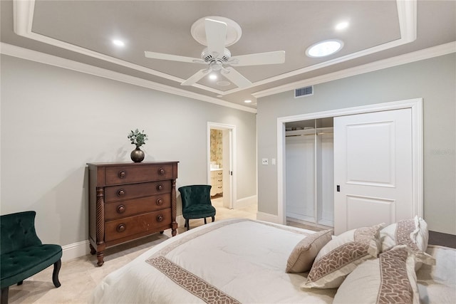 bedroom with ensuite bath, ornamental molding, a closet, and ceiling fan