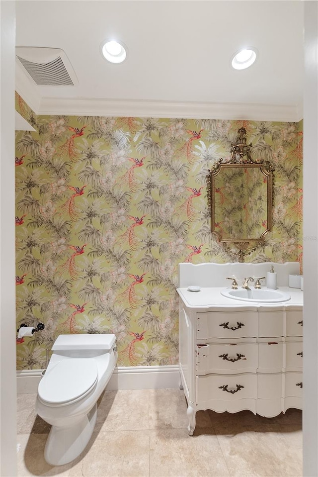 bathroom with vanity, crown molding, toilet, and tile patterned flooring