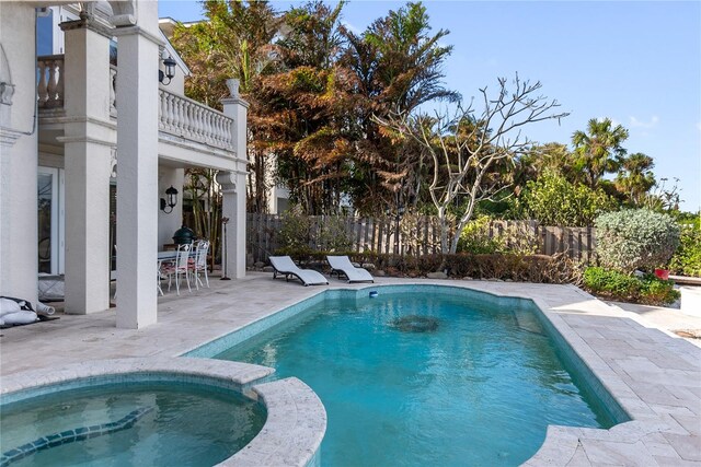 8213 Midnight Pass Rd, Sarasota, FL 34242 - view of swimming pool featuring fence, a patio, and a pool with connected hot tub