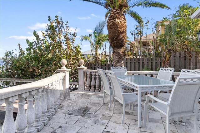 8213 Midnight Pass Rd, Sarasota, FL 34242 - view of patio featuring outdoor dining area and fence