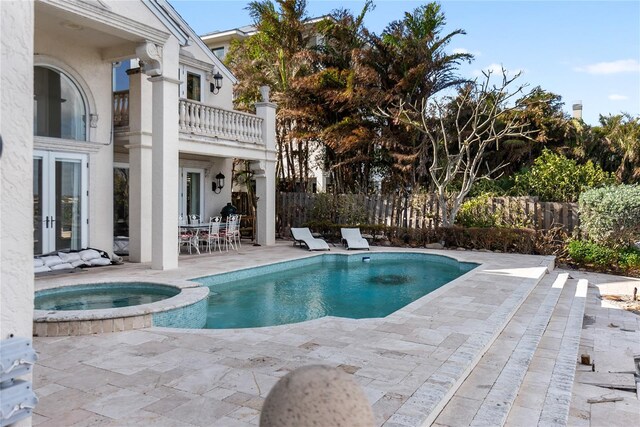 8213 Midnight Pass Rd, Sarasota, FL 34242 - view of swimming pool with a pool with connected hot tub, fence, and a patio area
