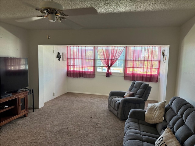 carpeted living room with ceiling fan