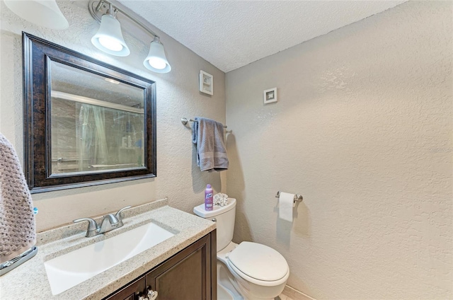 bathroom with a textured ceiling, toilet, a shower, a textured wall, and vanity