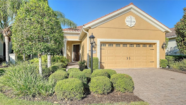 view of front of home with a garage