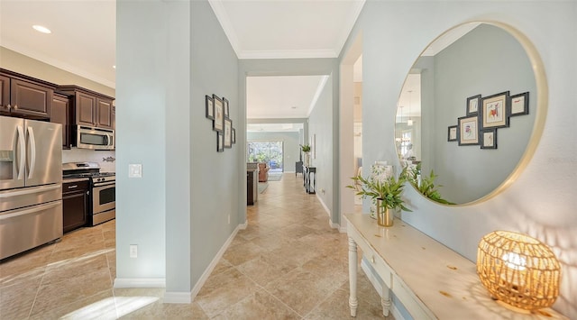 corridor with crown molding and light tile patterned floors