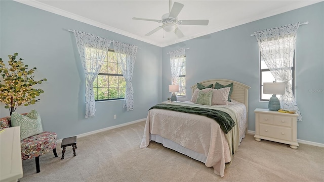 carpeted bedroom featuring multiple windows, crown molding, and ceiling fan