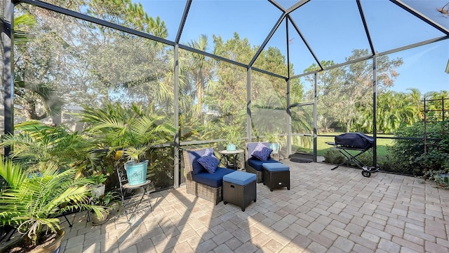 view of patio featuring a lanai and grilling area