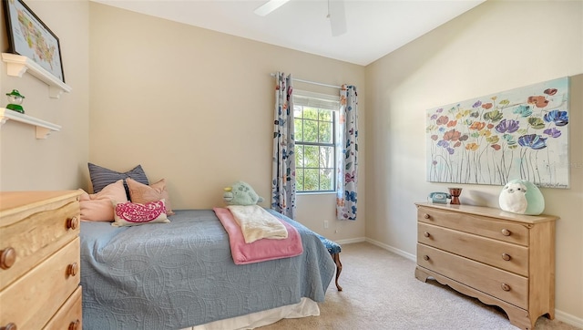 bedroom featuring ceiling fan and light colored carpet