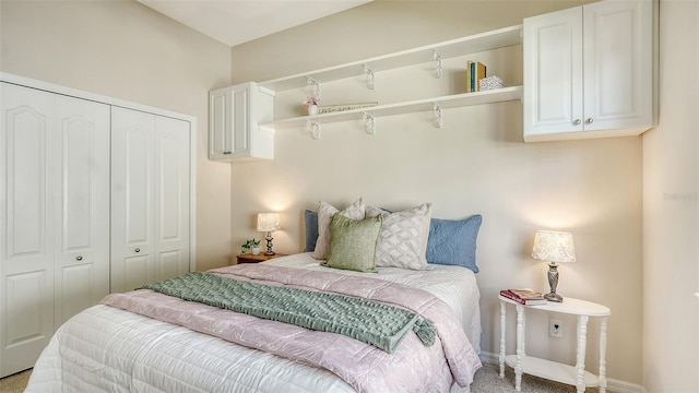 carpeted bedroom featuring a closet