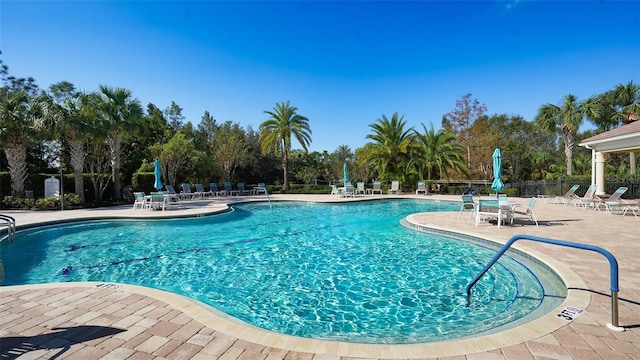 view of swimming pool with a patio