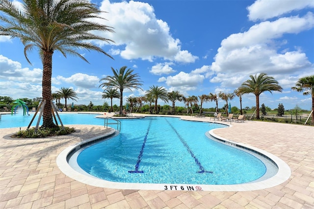 view of swimming pool featuring a patio area