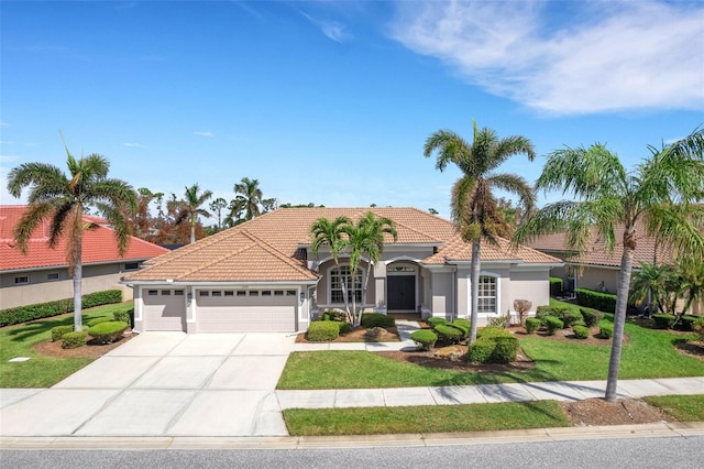 mediterranean / spanish-style house with a front lawn and a garage