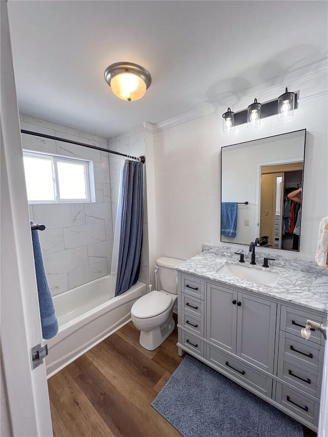 full bathroom featuring vanity, toilet, shower / tub combo, and hardwood / wood-style floors