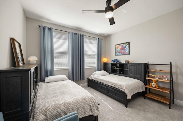 bedroom featuring light carpet and ceiling fan