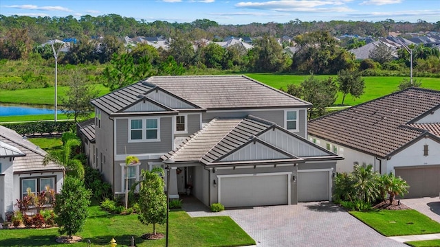 view of front of property with a front lawn and a garage