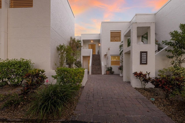 view of exterior entry at dusk