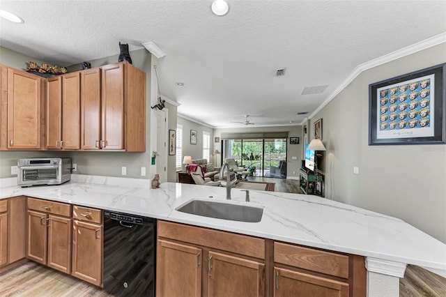 kitchen featuring kitchen peninsula, a textured ceiling, dishwasher, light hardwood / wood-style floors, and sink