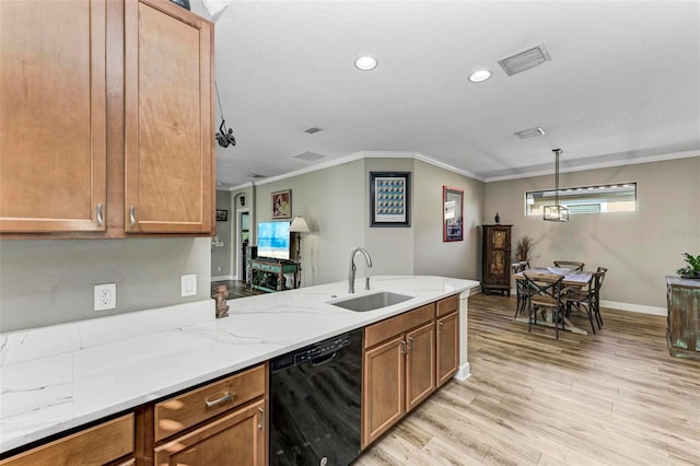 kitchen with dishwasher, ornamental molding, sink, pendant lighting, and light wood-type flooring