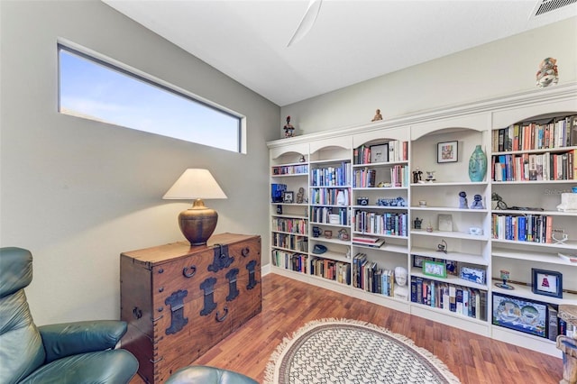 sitting room with hardwood / wood-style flooring