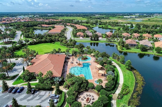 birds eye view of property featuring a water view