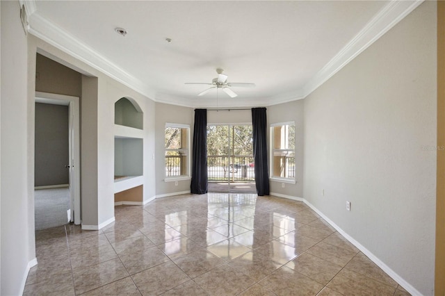 spare room featuring light tile patterned floors, crown molding, built in features, and ceiling fan