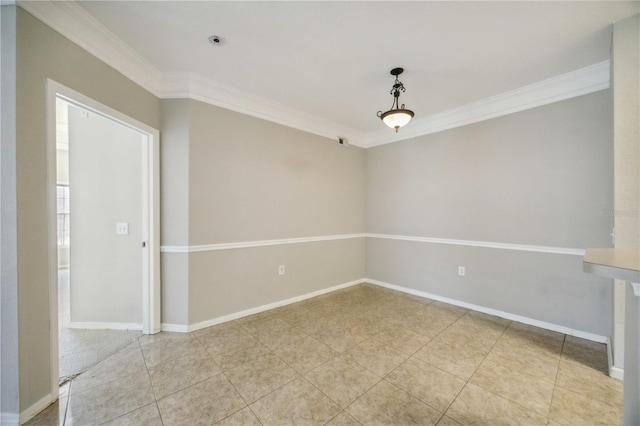 spare room with crown molding