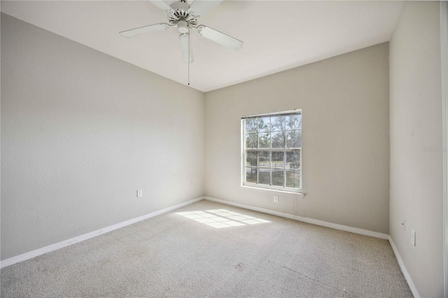 empty room featuring light carpet and ceiling fan